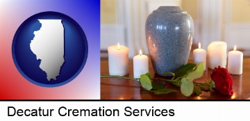 cremation urn with red rose and burning candles in Decatur, IL