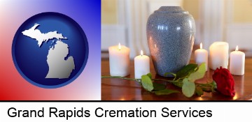 cremation urn with red rose and burning candles in Grand Rapids, MI