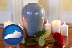 kentucky map icon and cremation urn with red rose and burning candles