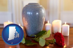 rhode-island map icon and cremation urn with red rose and burning candles