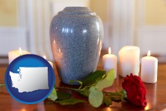 washington map icon and cremation urn with red rose and burning candles