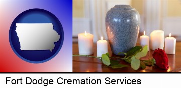 cremation urn with red rose and burning candles in Fort Dodge, IA