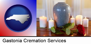 cremation urn with red rose and burning candles in Gastonia, NC