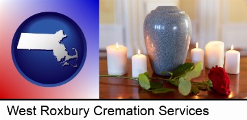 cremation urn with red rose and burning candles in West Roxbury, MA