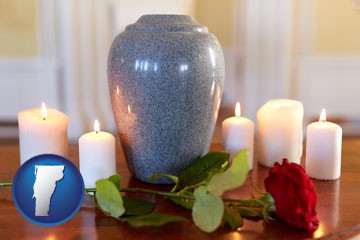 cremation urn with red rose and burning candles - with Vermont icon